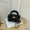 Bolso de cadena de alta costura para mujer, bolso de hombro acolchado con cierre de broche único, bolso de mano y bolso cruzado versátil de moda estilo coreano