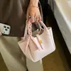 Bolsa tote de seda nueva y elegante para comercio exterior al por mayor, bolsa para mujer, estilo coreano, bolso cubo retro de nicho, bolso de hombro, bolso cruzado