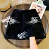 Falda corta vintage de lentejuelas con bordado pesado para mujer, otoño 2026 nueva falda corta de cintura alta adelgazante línea A A14154
