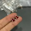 Pendientes de alta gama en forma de calabaza de oro V con incrustaciones de ágata roja y diamantes, delicados y compactos, diseño hueco, pendientes versátiles, directo del fabricante