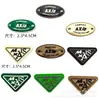 Etiquetas de PVC en relieve en stock para zapatos y sombreros, etiquetas de marca de moda, parches decorativos impresos en goma, calcomanías de silicona, accesorios de ropa, materiales de confección