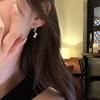Aretes de borla de perla explosión 2025 aretes de alta gama para mujer nuevos aretes sin agujeros en las orejas aretes de temperamento de lujo ligero al por mayor