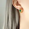 Moda francesa temperamento retro socialité ins nicho vidrio verde blanco piedra cruz acero de titanio transfronterizo pendientes joyería para mujer