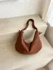 Bolsa translúcida de gran capacidad transfronteriza para mujer, nuevo diseño de moda casual tipo bolsa de albóndiga, bolso vintage para el hombro y cruzado para el día a día.