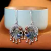 Carácter plata s925 plata moda retro azul quemado pavo real filigrana borla pendiente simple damas nicho pendientes