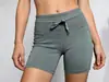 Venta directa de fábrica de leggings deportivos para mujer de talla estándar estadounidense con cintura acanalada de alta elasticidad, hechos de tela similar al nailon que no irrita la piel.