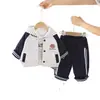 2026 Sudadera con capucha a rayas para béisbol de otoño para niños Cardigan deportivo de manga larga para niñas Conjunto de tres piezas Comercio exterior
