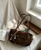Nuevo diseño de nicho 2026, hebilla retro, bolso tote de gran capacidad, bolso de hombro, bolso para el trabajo, bolso elegante para el trabajo