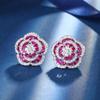 Otoño e Invierno nuevo estilo joyería Zhuang Sheng cobre base chapado en oro simulación corindón rojo rosa temperamento lujo ligero traje mujeres
