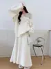Conjunto de punto suave estilo francés 2026 otoño e invierno nuevo conjunto de dos piezas de suéter con flores tridimensionales + falda larga para mujer