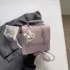 Bolso de mujer transfronterizo 2026 nuevo modelo bandolera de un solo hombro bolso de mano bolso cuadrado pequeño versión popular de internet coreana estilo británico estilo universitario mochila