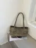 Outono/Inverno 2026 Novo Estilo Coreano Retrô Nicho Cadarço Ombro Único Bolsa de Axila Feminina Versátil Bolsa de Mão para o Dia a Dia Bolsa Tote