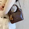 Bolso de hombro de nicho nuevo, retro, simple, versátil, moderno, estilo coreano de otoño, bolso de mano para el trabajo 2026 para mujer