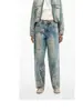 Pantalones largos azules bordados con elaborados bordados florales, moda callejera popular europea y americana para mujer.