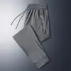 Calças Pretas de Secagem Rápida no Atacado, Calças de Seda Gelada, Calças Casuais Finas de Verão, Calças Esportivas Largas Elásticas de Jogger, Tamanho Grande