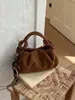 Bolso pequeño retro para mujer, moda otoño/invierno 2026, diseño de nicho, bolso de hombro cruzado, versión coreana, bolso tipo bollo ins