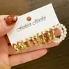 Nuevo Juego de Pendientes de Estilo Europeo y Americano con Rayas Trenzadas, Diseño Retro Geométrico, Sensación Simple y de Alta Gama, Juego de Pendientes de Botón de Nueve Piezas para Mujer