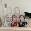 Bolsa de ombro fofa estilo coreano transfronteiriça, nova bolsa simples para o dia a dia verão 2026, bolsa de ombro estilosa de alto valor
