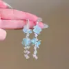 Brincos de borla de flor estilo fada estilo feriado para mulheres, brincos doces para viagem à beira-mar, brincos de cristal bonitos com contas, atacado