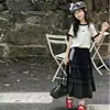 Conjunto de Verano para Niñas 2026 Nuevo Casual Estilo Coreano para Niños Medianos y Mayores Rayas Manga Corta Falda de Pastel Conjunto de Dos Piezas Moderno