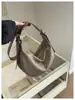 Nova bolsa carteiro de bolinho transfronteiriça para mulheres, bolsa de ombro única e transversal, versão coreana, casual e versátil, bolsa de moda feminina em couro PU macio