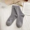 Calcetines de lana australiana gruesos, cálidos y resistentes al frío para otoño e invierno, calcetines altos elásticos antideslizantes hasta la rodilla, color liso, calcetines largos de alta gama para mujer