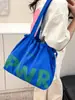 Bolsa de Ombro Feminina de Verão 2025 Casual de Grande Capacidade Bolsa Tote Casual de Lona de Nylon Bolsa para Estudante