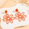 Aretes de flor hueca tejidos a mano en rafia, de color personalizado transfronterizo para verano, estilo vacacional fresco y pequeño de Europa y Estados Unidos