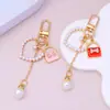 Mini Bolso Colgante Llavero Perla Amor Borla Colgante Niña Funda de Auriculares Decoración Accesorios DIY