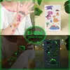 Pegatinas de Tatuaje de Dibujos Animados para Niños, Mundo de Dinosaurios Luminoso, Pegatinas Temporales Impermeables para Cara de Niños y Niñas, Stock Listo Transfronterizo