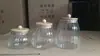 Entrega de fábrica Tarro sellado de vidrio de borosilicato alto vidrio resistente al calor tapa de bambú tarro para té tarro triangular tarro de almacenamiento botella de almacenamiento