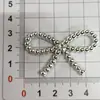 Accesorios de joyería DIY de mariposa cruzada agujero zapatos hebillas de zapatos pegatinas para funda de teléfono accesorios accesorios de lazo