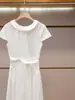 Shenzhen Nanyou alta costura feminina nova coleção de verão estilo casual elegante vestido branco de manga curta que afina a cintura