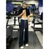 Pantalones deportivos tipo color block estilo americano para hombre, colección otoño 2026, con un diseño audaz y curvo, corte recto y estilo casual versátil