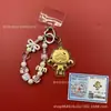 Llavero de tela con logo de empresa personalizado Cadena para teléfono móvil Angela Lámina de oro puro Oro 999 Regalo de aniversario