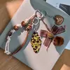 Collar Colgante Cruz de Cuero Maillard para Mujer Cadena Larga con Borlas para Suéter Diseño Dulce Fresco Cadena para el Cuello