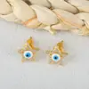 Pendientes Europeos y Americanos Transfronterizos Explosivos Chapados en Oro Cobre Circonita Ojo del Diablo Pendientes de Diseño de Estrella de Cinco Puntas de Nicho de Moda