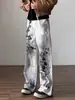 Pantalones vaqueros rectos desgastados con estampado de grafiti retro y colorido para mujer, colección verano 2026, de talle alto y pierna ancha.