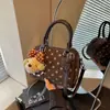 Bolso Boston de color de bloque de lunares de nicho transfronterizo para mujer, nuevo bolso de hombro y cruzado informal con textura para el verano de 2026