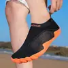 Zapatos de natación para playa transfronterizos, zapatos para vadear al aire libre, calcetines, zapatos para hombres y mujeres, zapatos para vadear en parques acuáticos, playa antideslizantes, amigables con la piel, negro-naranja