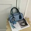 Bolsa de bowling casual de mezclilla, nuevo modelo de invierno 2026, elegante y simple, de un solo hombro, de mano, cruzada para mujer