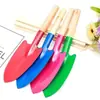 Suministro del fabricante de juego de jardinería con mango de vinilo, pala para flores, rastrillo de cinco dientes, herramientas para recoger conchas para niños, pala pequeña de jardinería