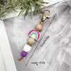 Llavero de madera de arcoíris y cuentas de silicona más vendido transfronterizo, pulsera de cuentas, accesorio decorativo para bolso, pulsera