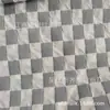 Cuadrículas de Diamantes Cuadradas Pequeñas Textura Cóncava y Convexa Estereoscópica Espuma Arrugada en la Parte Posterior Revestimiento de Malla Compuesta Tejido de Maleta de Moda