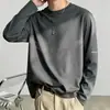 Camiseta de manga larga para hombre, adecuada para primavera y otoño, corte holgado, cuello redondo, capa interior fina, base elástica, versátil y moderna