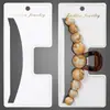 Clip Grande para Cola de Caballo Colgable 13.5cm Etiquetas Colgantes Venta al por Mayor Clip de Garra de PVC Blanco Lechoso Tarjeta Impresa con Lámina de Oro