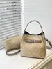 Bolso tipo cubo Kouhua para mujer 2026 Nuevo Verano Lujo Ligero Diseño de nicho Moda de alta gama Versátil Bolso de mano Transfronterizo