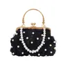 Yuezhi retro simple lujo ligero elegante 2026 primavera nuevo bolso de mano versátil con cadena de perlas para mujer con un toque de alta gama