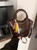 Bolso de Mano de Lujo Ligero Estilo Coreano para Mujer 2026 Primavera Nuevo Vintage Bolso Cubo para Viajes Diarios Bolso Cruzado Casual para Hombro