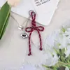 Nudo de Corazón Creativo Nuevo Estilo Miu Lanyard Versátil Llavero Colgante para Bolsas y Fundas de Teléfono